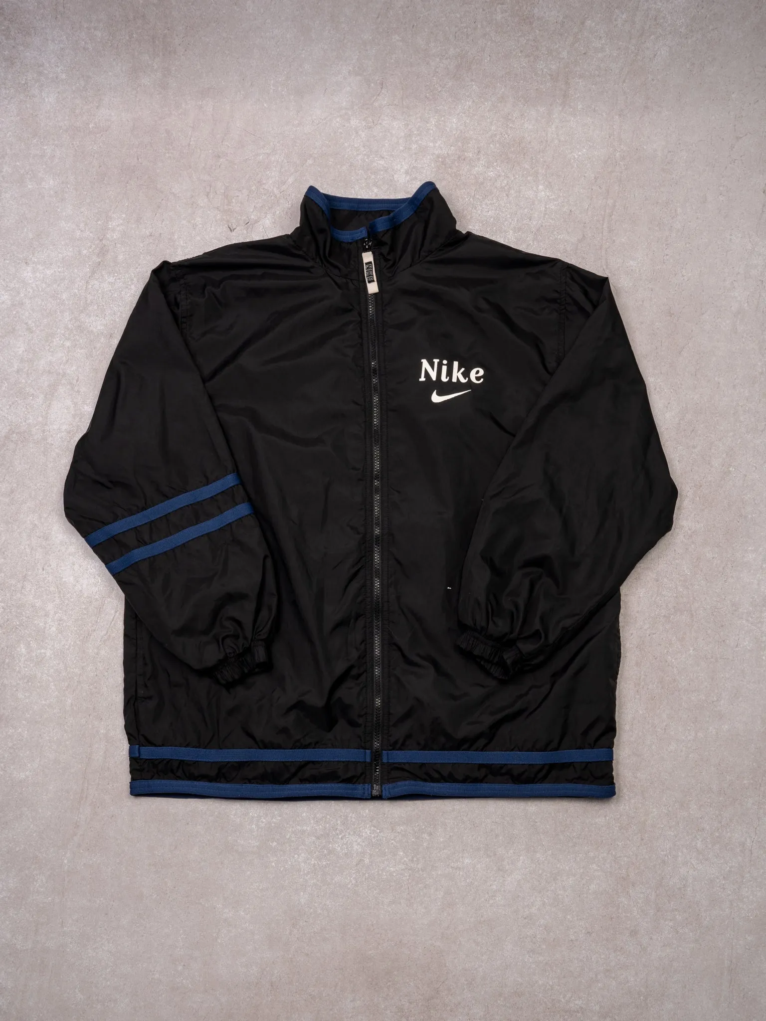 Vintage 90s Black + Blue Nike Zip Up Windbreaker (L) sold by Rebalance Vintage