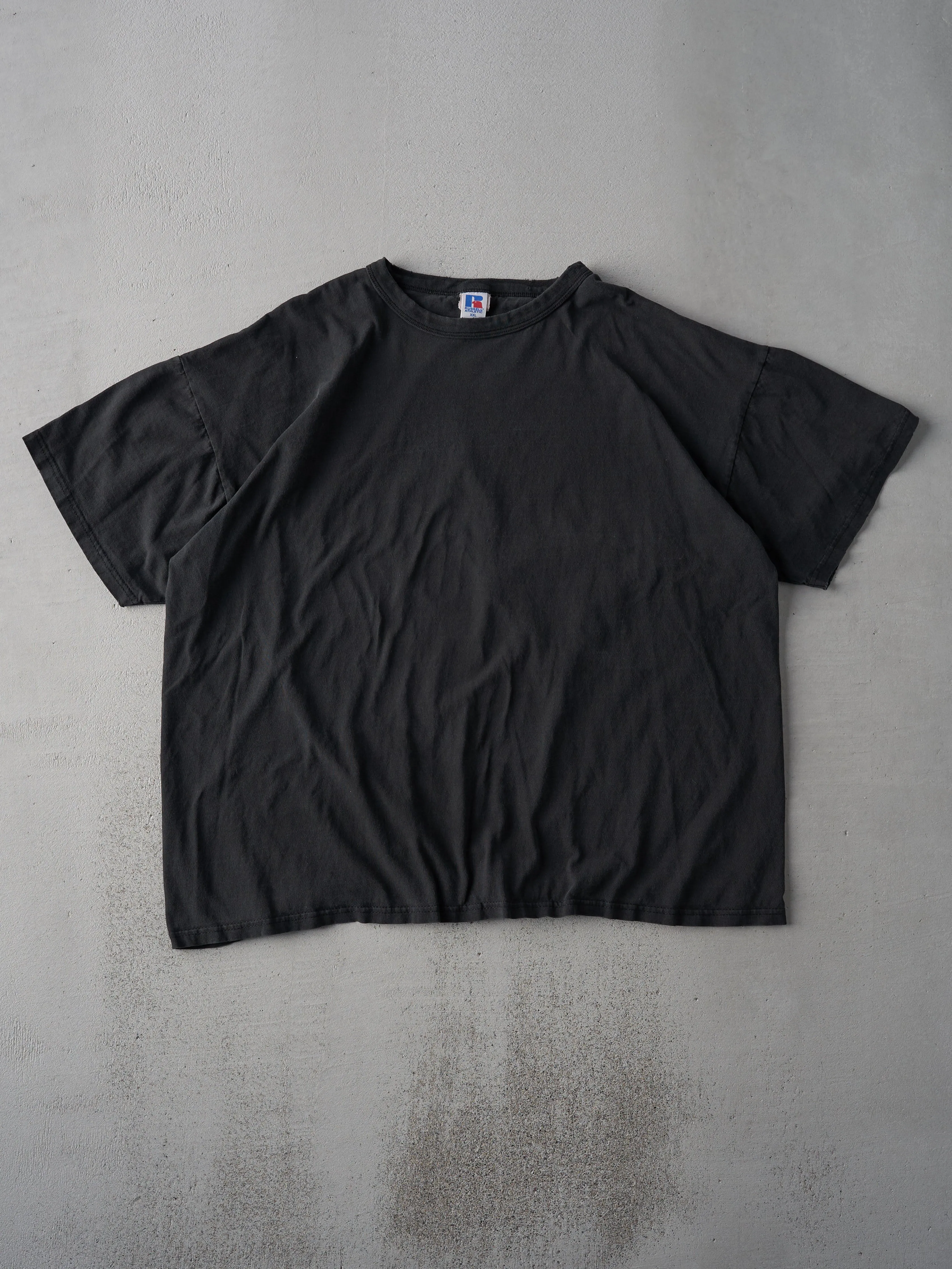 Vintage 90s Faded Black Russell Athletics Blank Tee (L/XL) sold by Rebalance Vintage