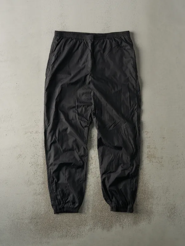 Vintage 90s Black Nike Tonal Embroidered Track Pants (35x31) sold by Rebalance Vintage