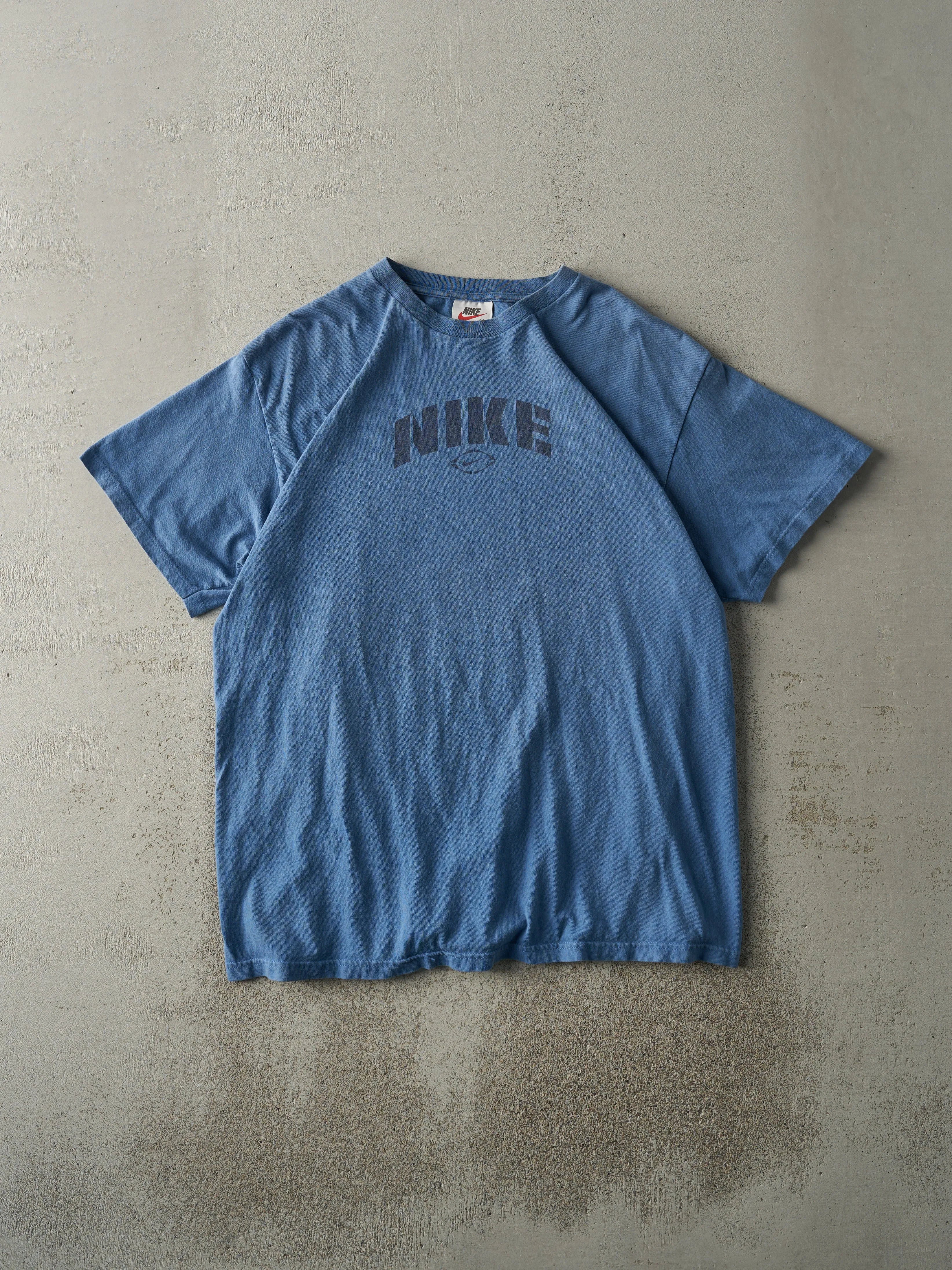 Vintage 90s Slate Blue Nike Logo Tee (M) sold by Rebalance Vintage