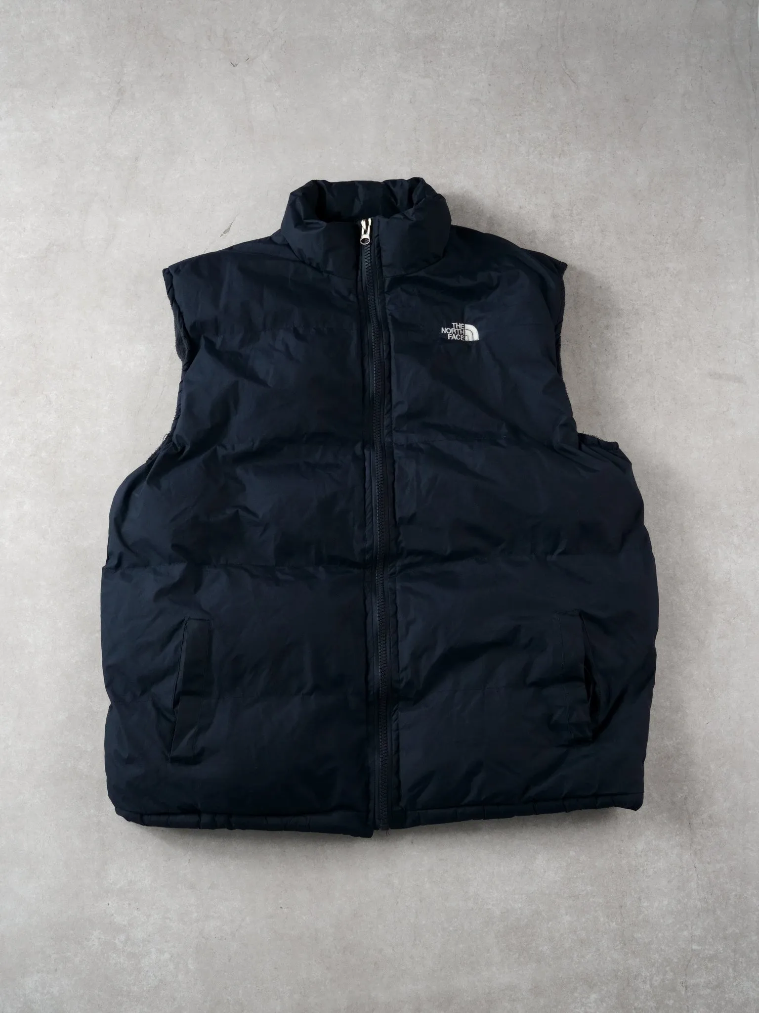 Vintage 90s Navy Blue Northface Puffer Vest (L) sold by Rebalance Vintage