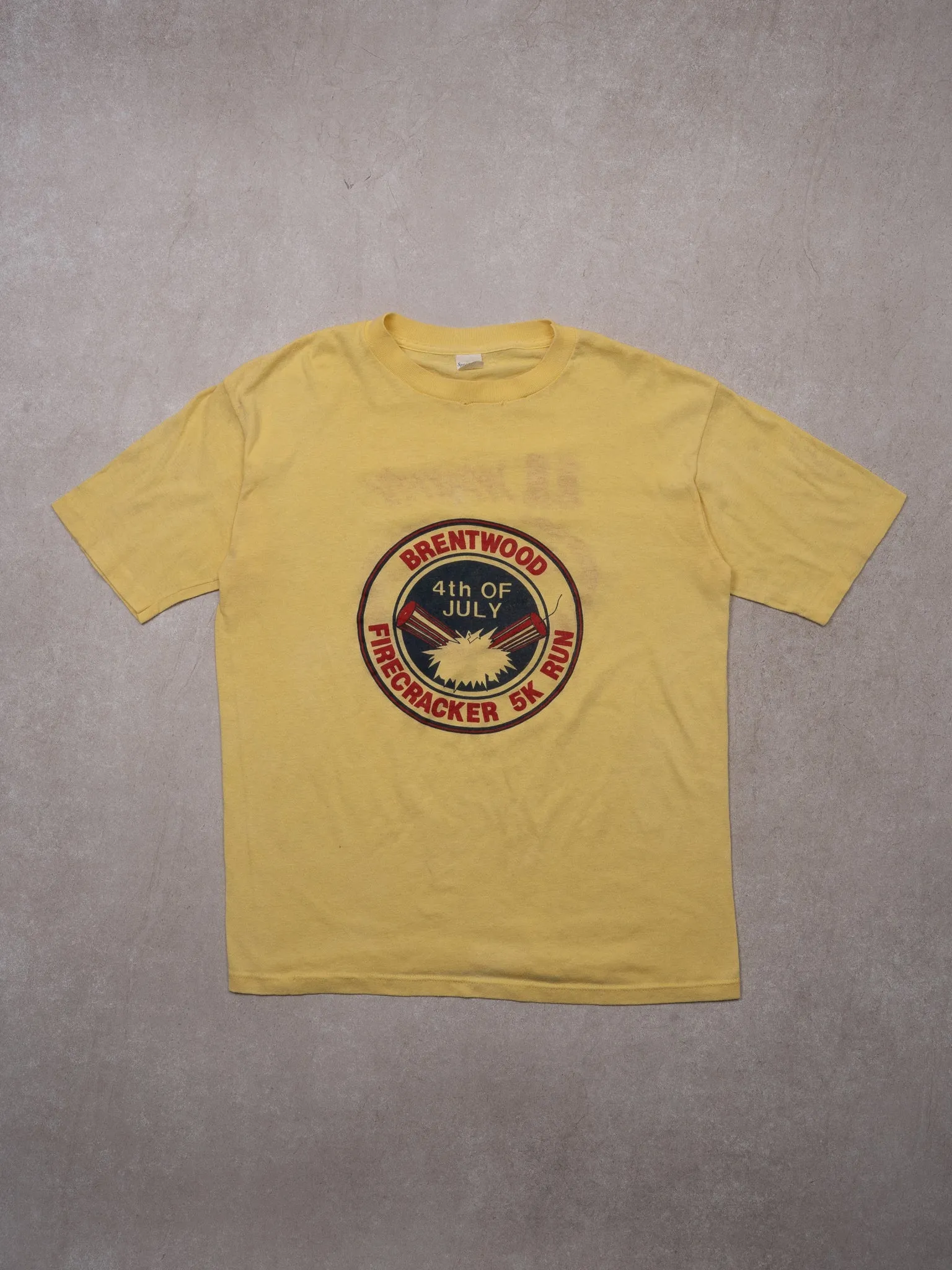VIntage 80s Yellow Brentwood 4th of July Single Stitch Tee (S/M) sold by Rebalance Vintage