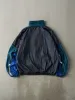 Vintage 90s Green, Blue & Black Wilson Windbreaker Jacket (L) sold by Rebalance Vintage