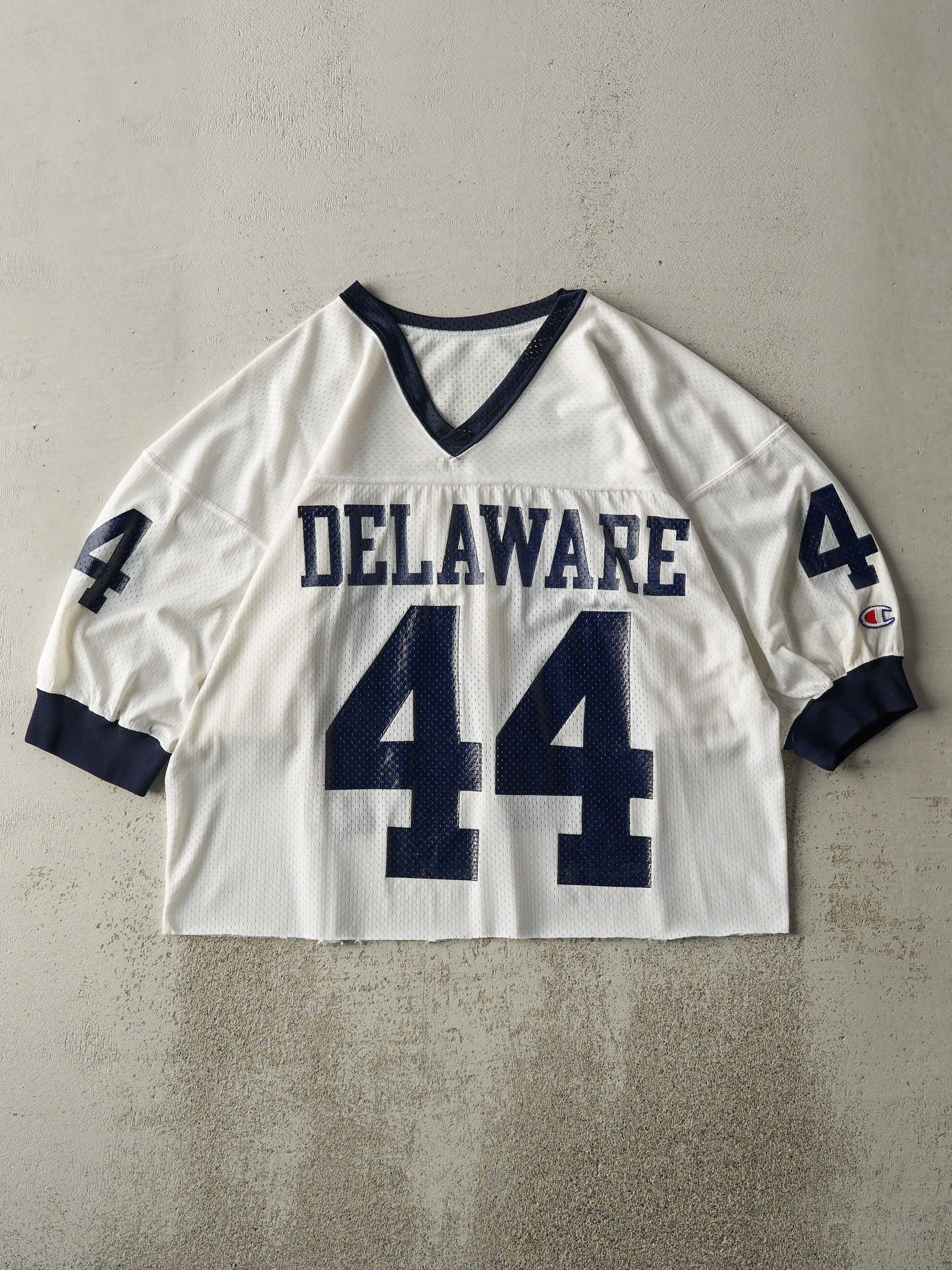 Vintage 90s White & Navy Delaware Cropped Jersey (M) sold by Rebalance Vintage