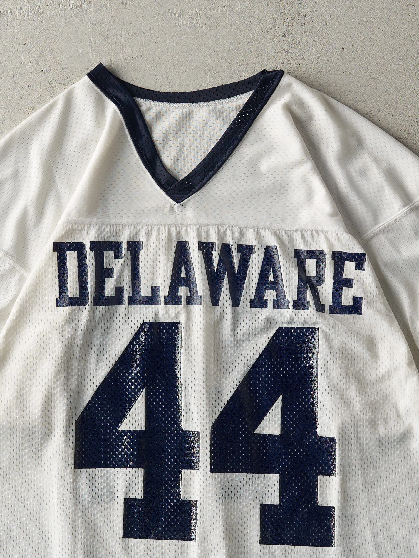 Vintage 90s White & Navy Delaware Cropped Jersey (M) sold by Rebalance Vintage product image thumbnail 4