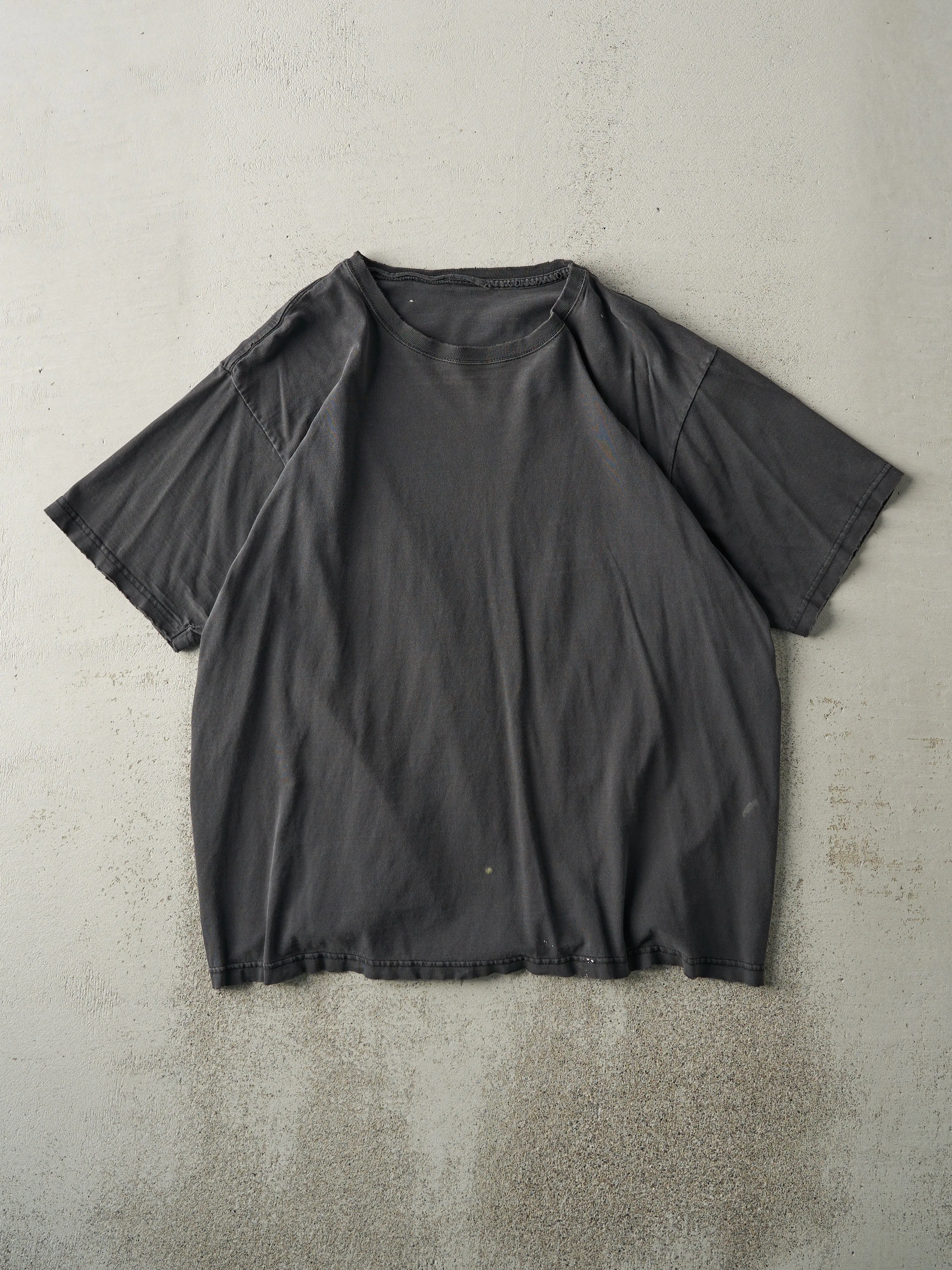 Vintage 90s Faded Black Blank Tee (M/L) sold by Rebalance Vintage