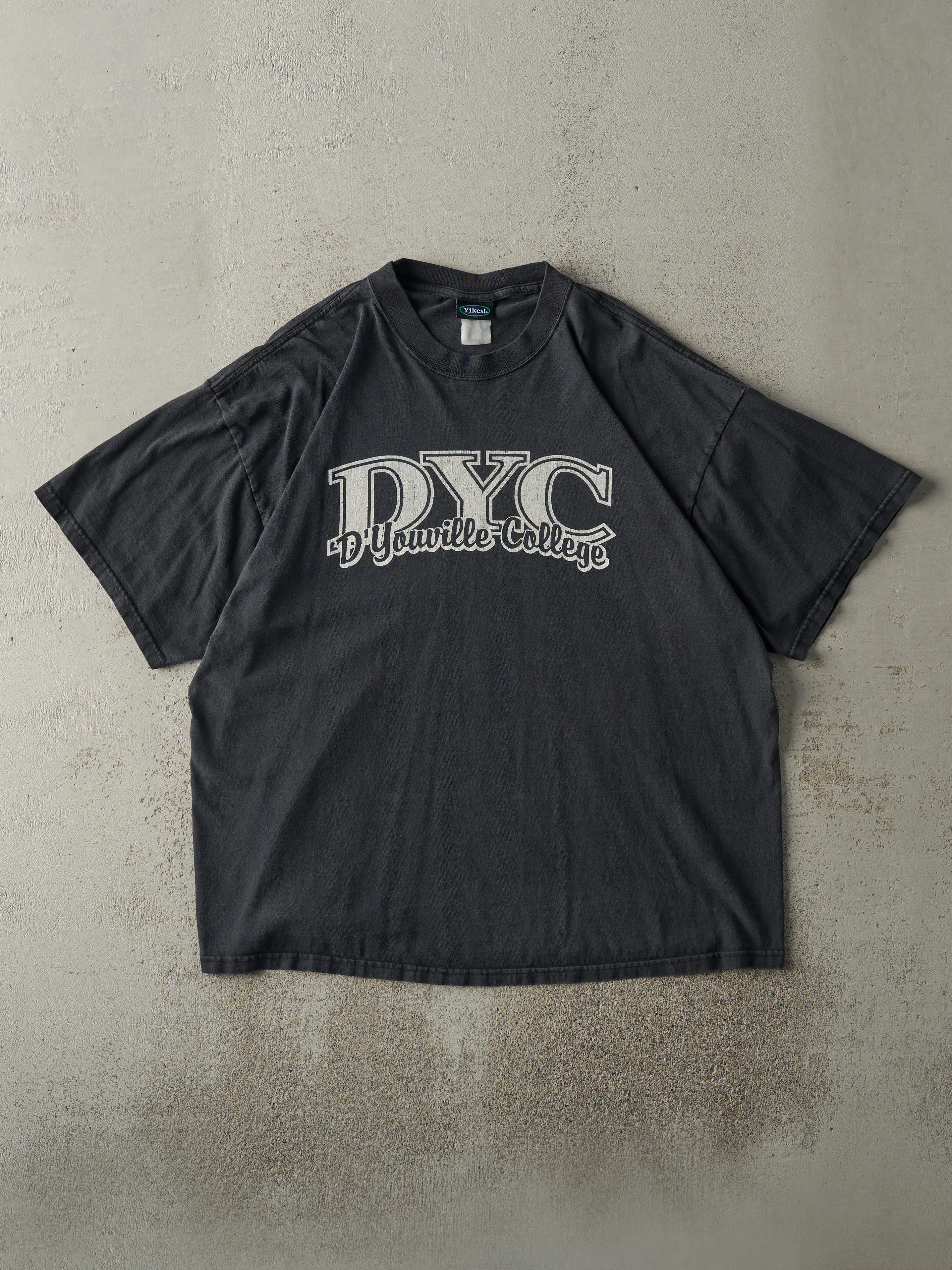 Vintage Y2K Faded Black D'Youville College Tee (L) sold by Rebalance Vintage