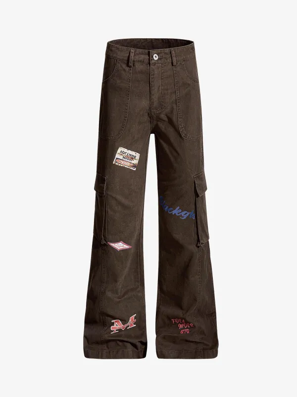 Retro Patchwork Graphic Multi-Pocket Flared Cargo Pants sold by Thesupermade