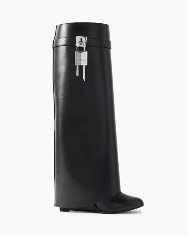 Shark Lock embellished glossed-leather knee boots sold by Larosa