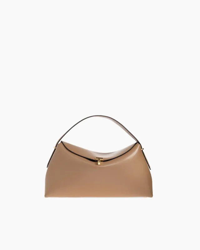 Curved Leather Top Handle Bag Metal Clasp sold by Larosa
