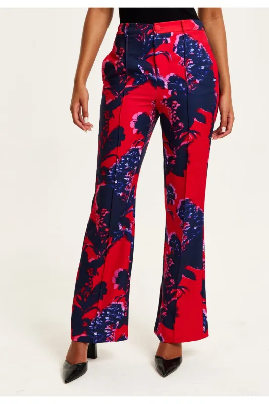 Liquorish Floral Print Tailored Red Trousers sold by Goddiva