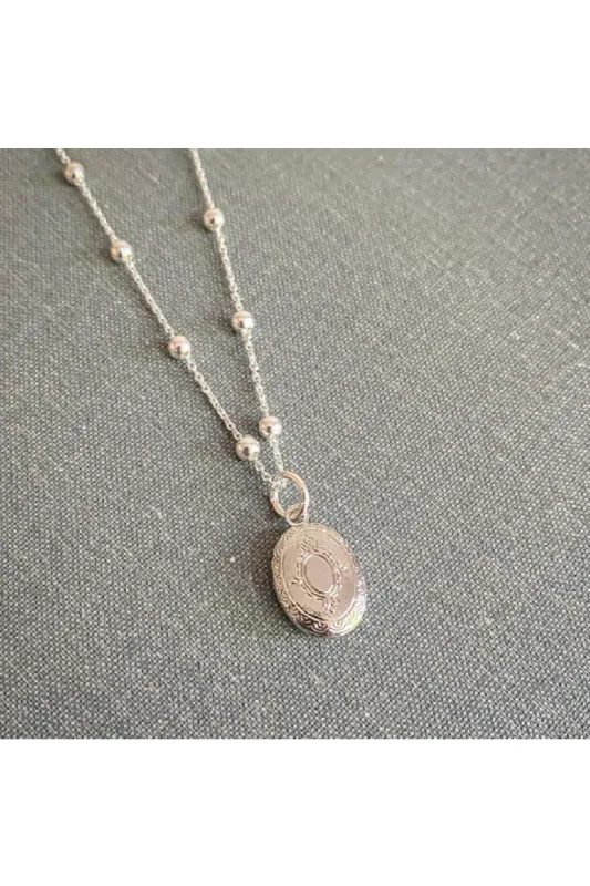 Wisteria London Tabitha Mini Silver Oval Locket On Bobble Chain sold by Goddiva