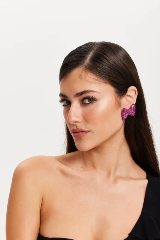 Diamonte Bow Stud Earrings In Pink by Liquorish made by Goddiva