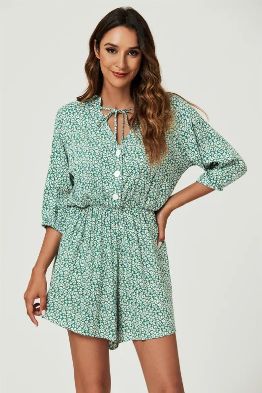 FS Collection Daisy Floral Print Boho Playsuit With Buttons In Green sold by Goddiva