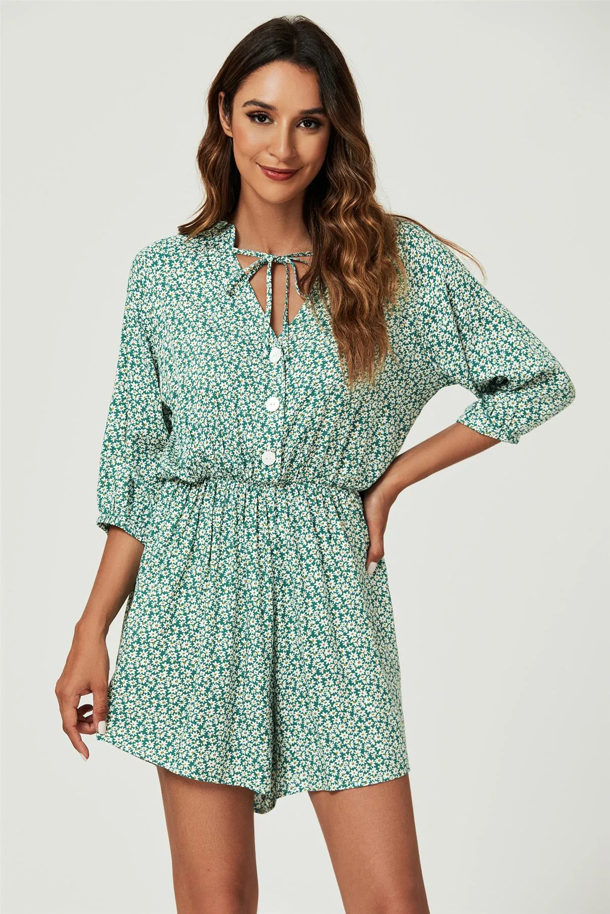 FS Collection Daisy Floral Print Boho Playsuit With Buttons In Green sold by Goddiva