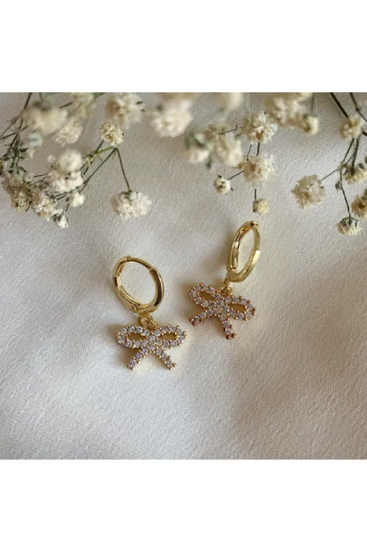 Wisteria London Audrey Dainty CZ Bow Huggie Hoop Earrings sold by Goddiva