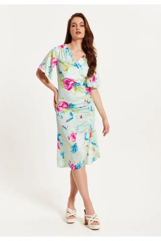 Liquorish Midi Wrap Dress With Floral Print In Mint Green sold by Goddiva