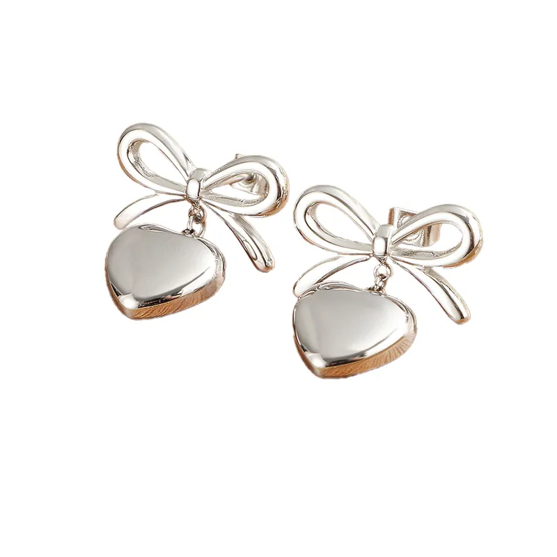 Heart Pendant Bow Earring In Silver by Last True Angel sold by Goddiva