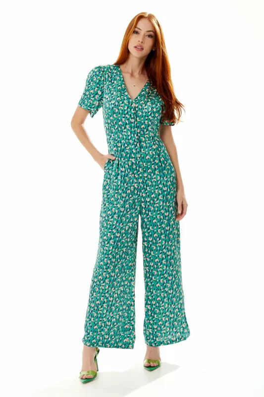 Liquorish Stroke Print Jumpsuit In Green sold by Goddiva