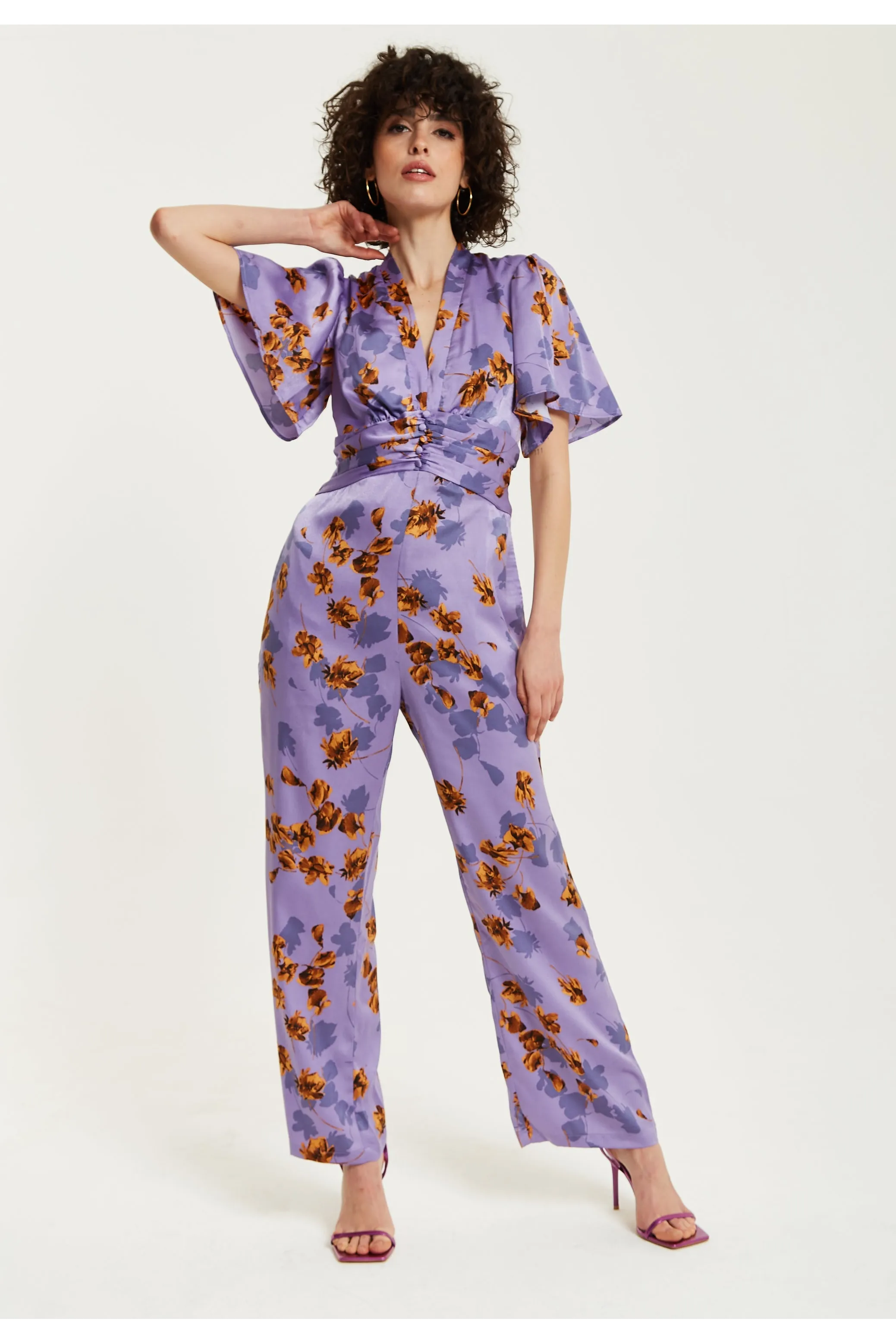 Purple Floral Wide Leg Jumpsuit With Angel Sleeves by Liquorish sold by Goddiva