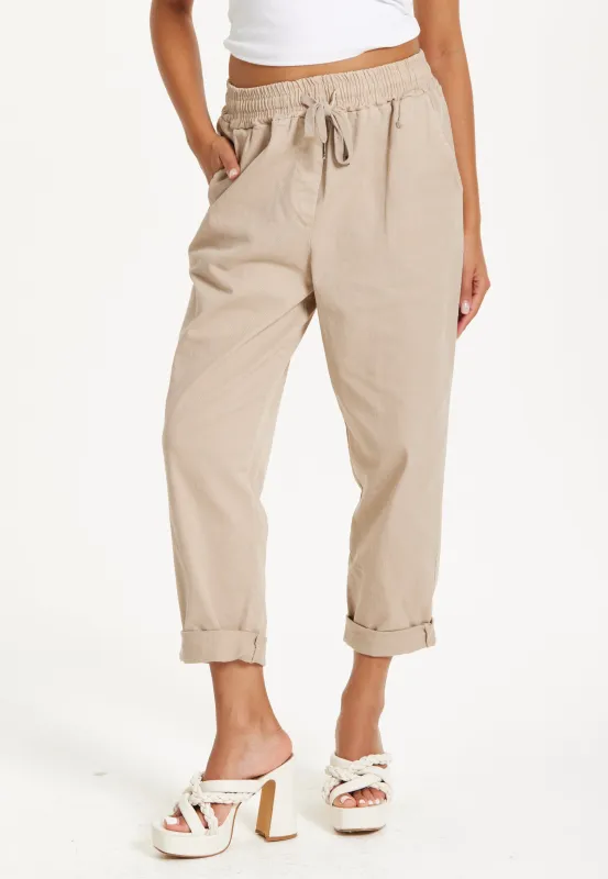 Beige Relaxed Fit Tapered Trousers by Liquorish sold by Goddiva