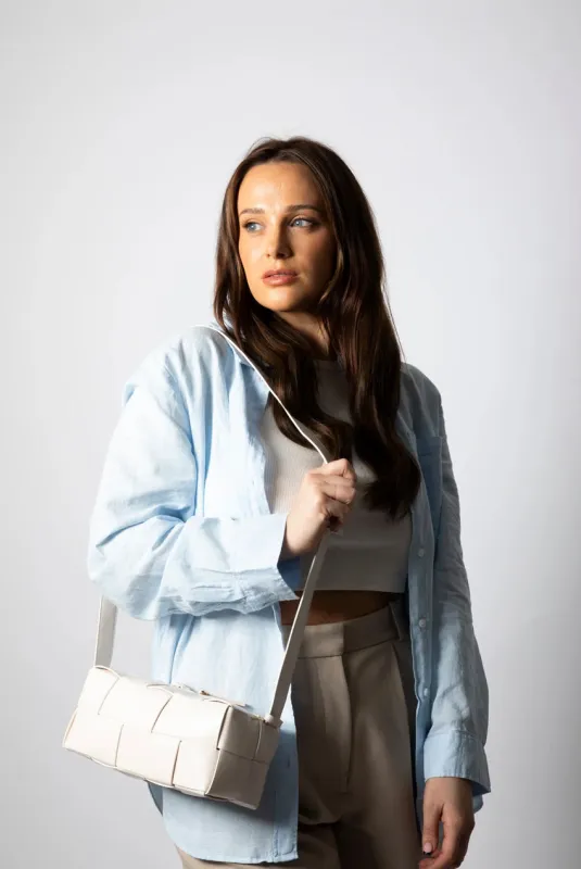 Woven PU Shoulder Bag In Cream by SVNX sold by Goddiva