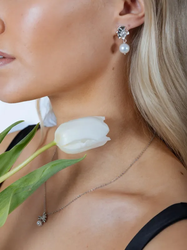 Flower Drop Pearl Earrings In Silver by SVNX sold by Goddiva