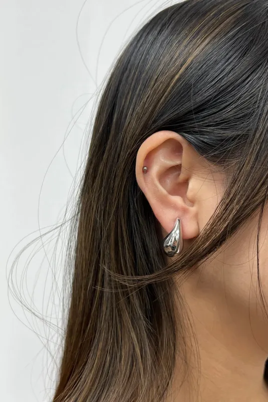 Mini Waterdrop Earring In Silver by SVNX sold by Goddiva