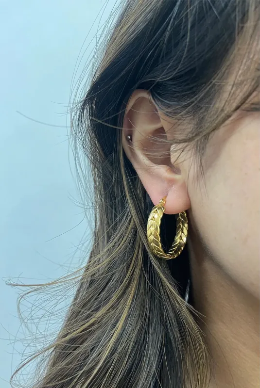 Braided Hoop Earrings In Gold by SVNX sold by Goddiva