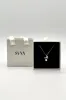 Dainty Bow Pearl Pendant Necklace by SVNX sold by Goddiva