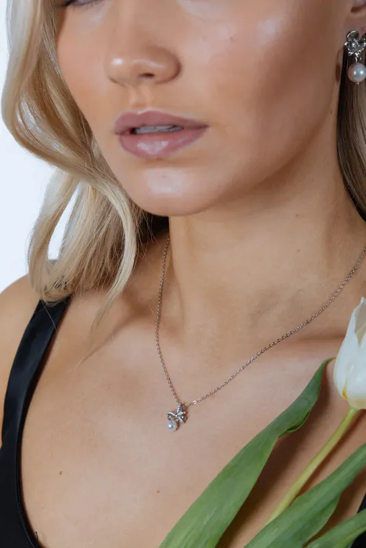 Dainty Bow Pearl Pendant Necklace by SVNX sold by Goddiva