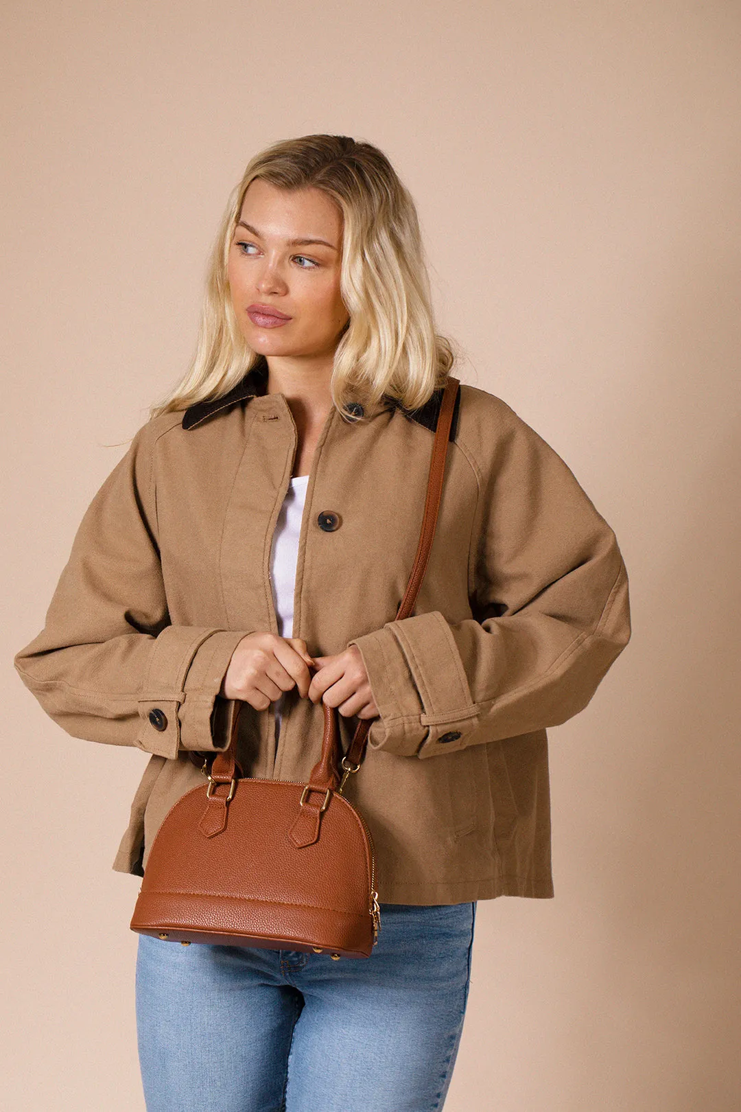 Faux Leather Mini Crossbody Bag In Brown by SVNX sold by Goddiva