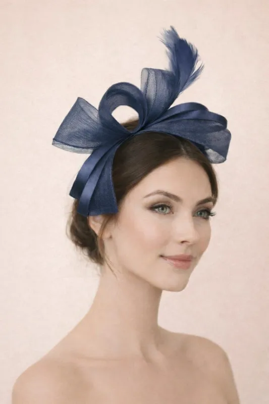 Bow Shaped Fascinator With Satin Loops & Feathers In Navy by SVNX sold by Goddiva