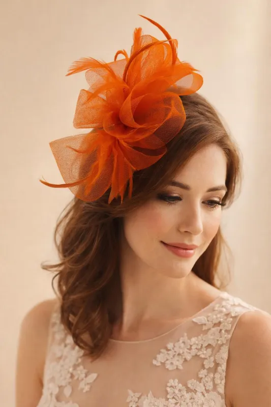 Knot Feather Fascinator In Orange by SVNX made by Goddiva