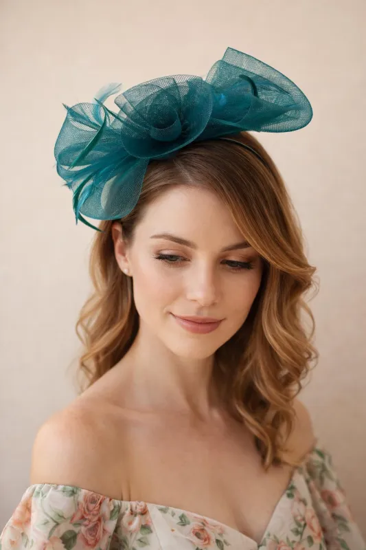 Knot Feather Fascinator In Green by SVNX made by Goddiva