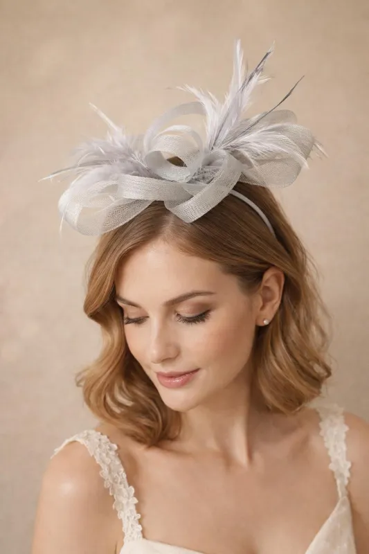 Bow Feather Fascinator In Silver by SVNX made by Goddiva