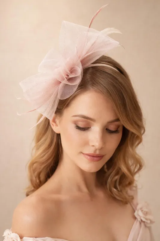 Knot Feather Fascinator In Pink by SVNX made by Goddiva