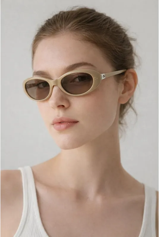 Oval Sunglasses In Beige - Foldable by SVNX made by Goddiva