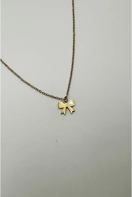 Mini Bow Pendant Necklace In Gold by SVNX made by Goddiva
