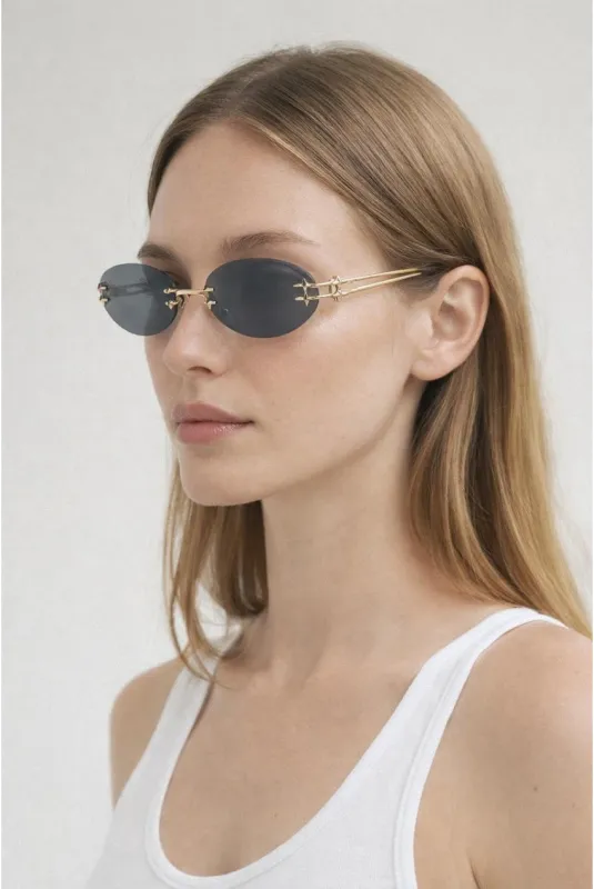 Rimless Oval Sunglasses In Black by SVNX made by Goddiva