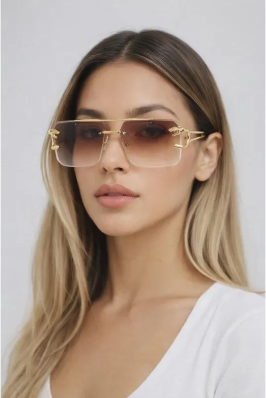 Rimeless Navigator With Side Detail Sunglasses In Brown by SVNX made by Goddiva