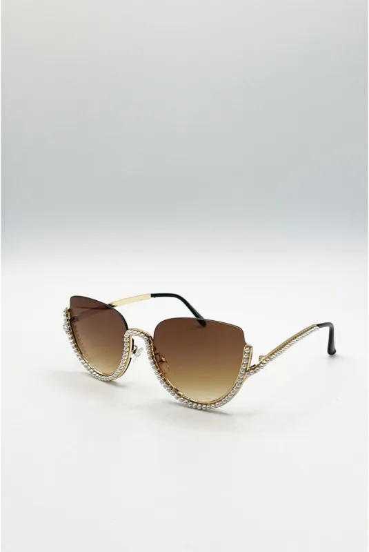 Upper Rimless Pearl Sunglasses In Gold Brown by SVNX made by Goddiva