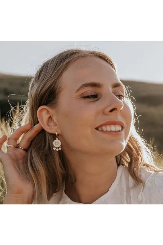 Wisteria London Amaya Evil Eye Huggie Hoop Earrings sold by Goddiva