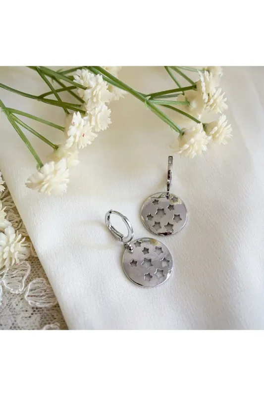 Wisteria London Halcyon Silver Star Huggie Hoop Earrings sold by Goddiva