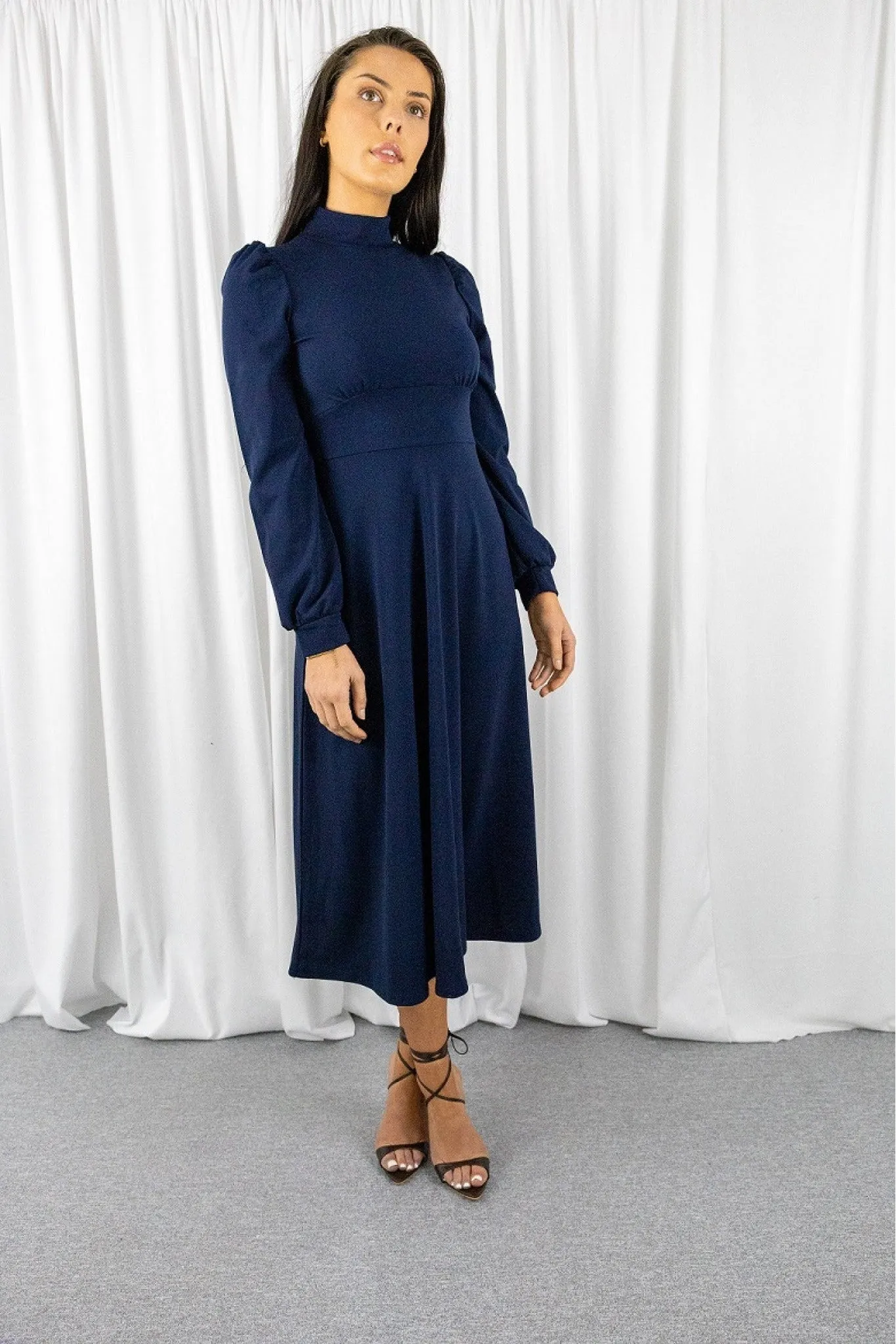 Signage Navy Long Sleeve Turtle Neck Midi Dress sold by Goddiva