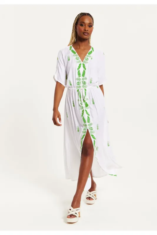 Liquorish White Maxi Beach Dress With Green Embroidery sold by Goddiva