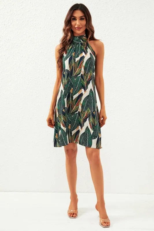 FS Collection Leaf Print Halter Neck Tie Back Mini Dress In Green sold by Goddiva