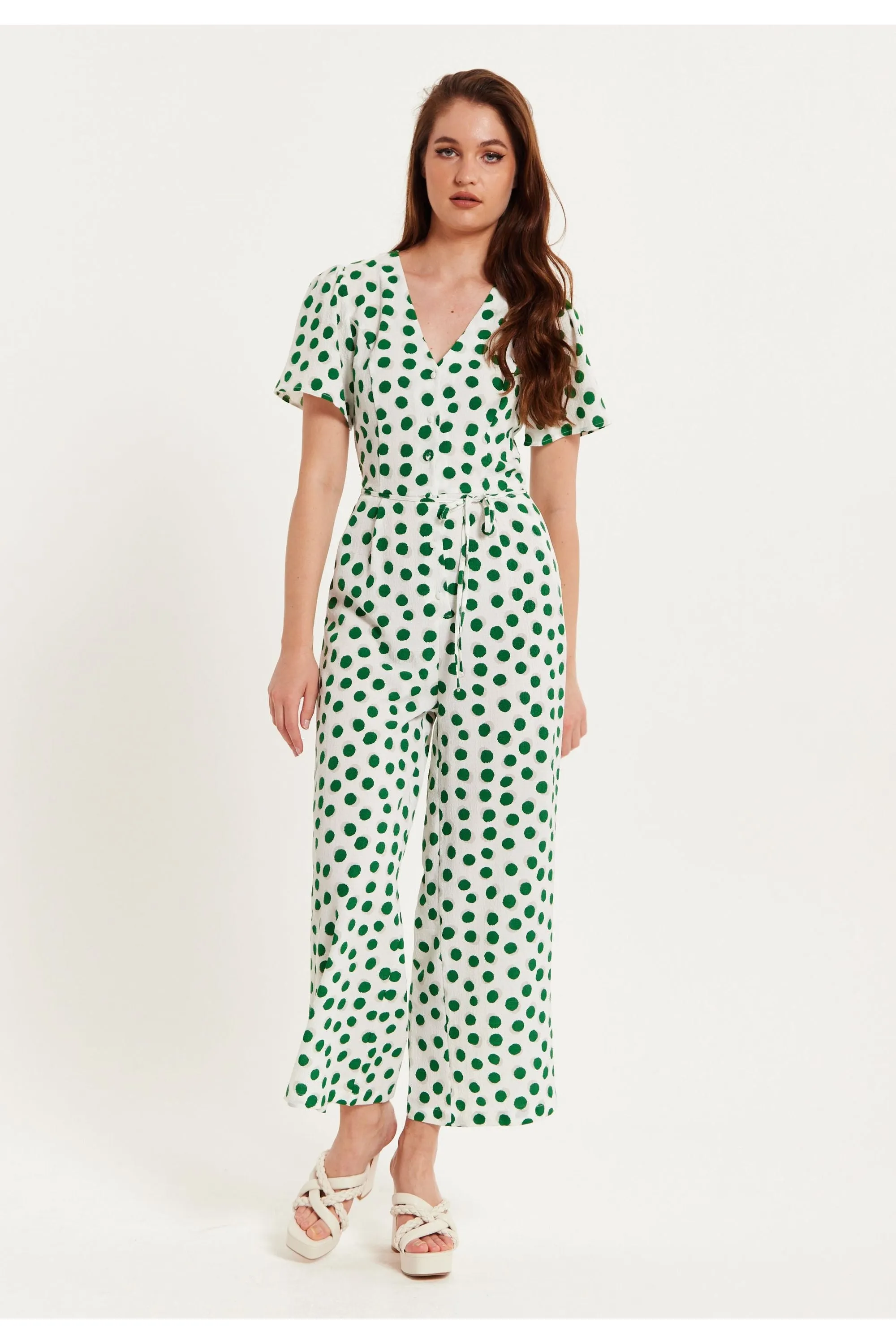 Liquorish Green Polka Dot Jumpsuit In White sold by Goddiva