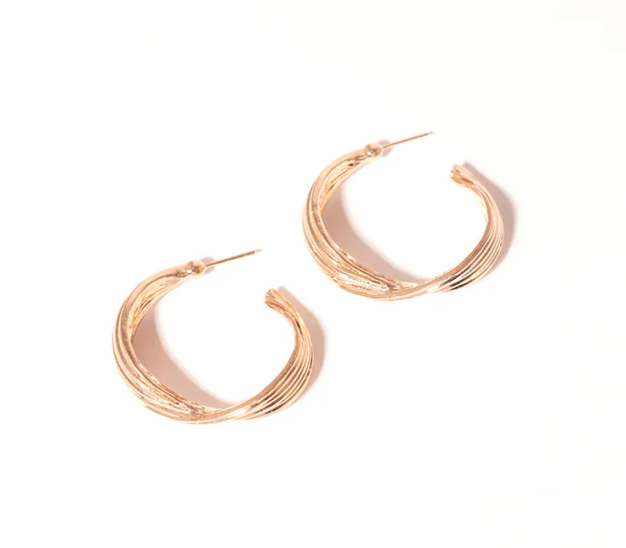 Twist Hoop Earrings sold by Rage