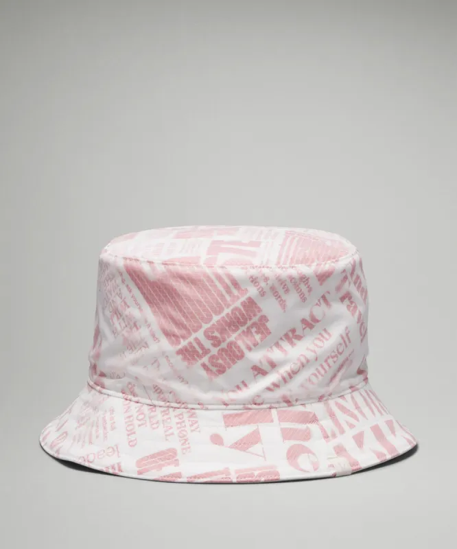 Both Ways Reversible Bucket Hat *Manifesto Print sold by Lululemon